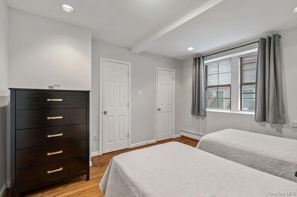 914 Wynnewood Road, Unit LL4 Pelham, NY 10803 - Photo 12 of 22 a bedroom with a bed and a window