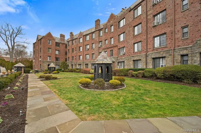 a large building with a yard in front of it