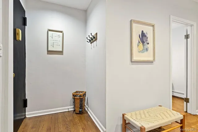 a view of room with window and wooden floor