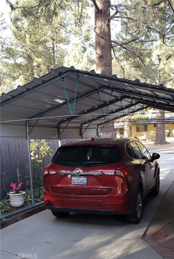 965 Snowbird Road Wrightwood, CA 92397 - Photo 4 of 28 a view of a cars park on the roof