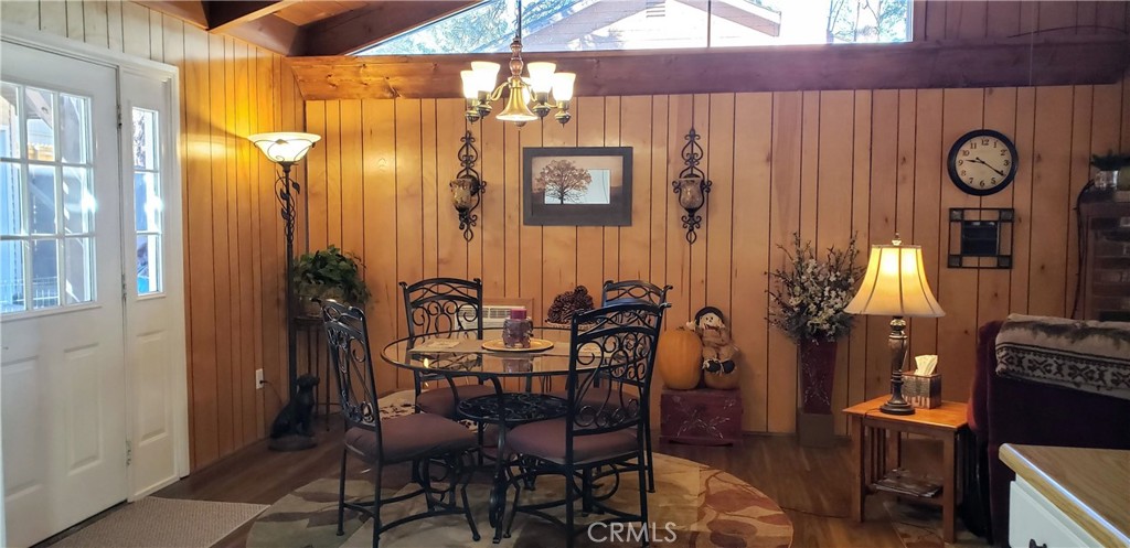 965 Snowbird Road Wrightwood, CA 92397 - Photo 6 of 28 a view of a dining room with furniture and chandelier
