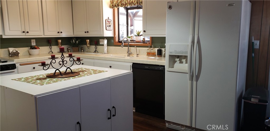 965 Snowbird Road Wrightwood, CA 92397 - Photo 10 of 28 a kitchen with a sink stove and cabinets
