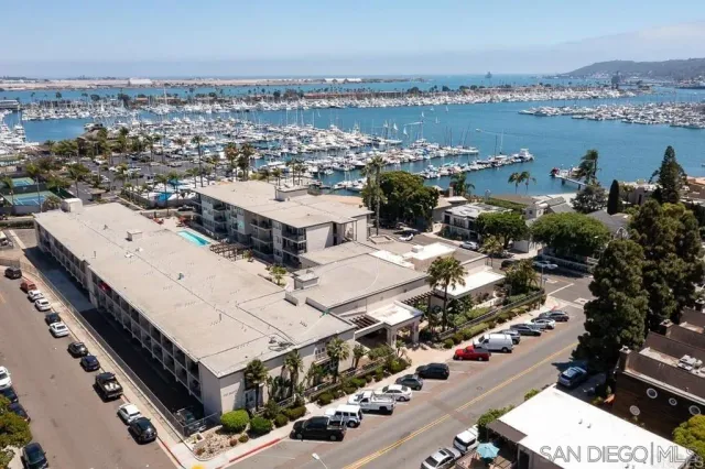 an aerial view of a residential building with outdoor space