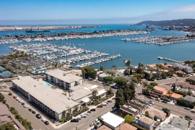 an aerial view of a city with ocean view