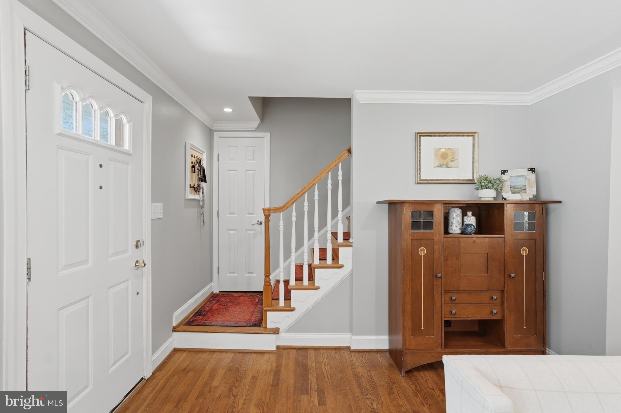 7006 Barnack Drive Springfield, VA 22152 - Photo 27 of 56 a view of entryway and hall with wooden floor
