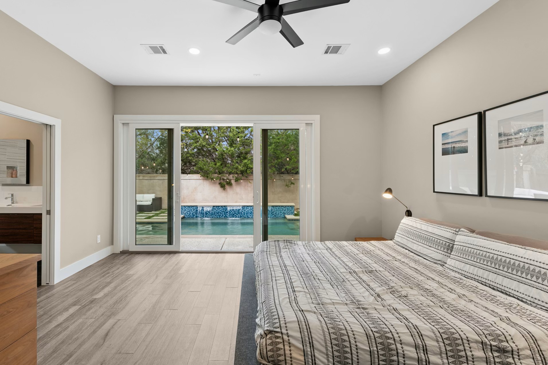 320 El Socorro Lane Austin, TX 78732 - Photo 15 of 40 a bedroom with a bed and a large window
