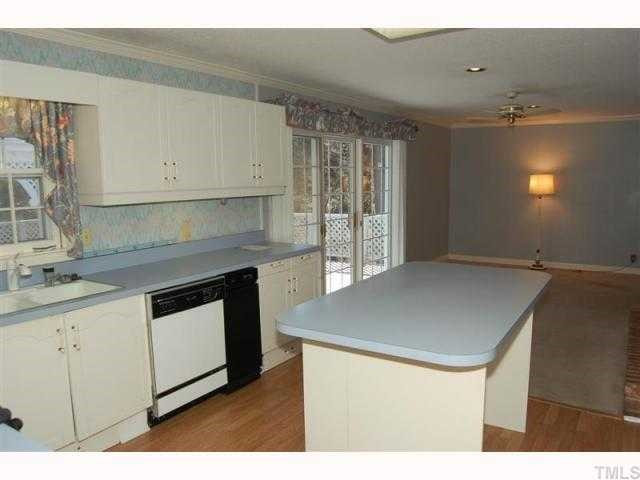 1428 10th Avenue Raleigh, NC 27607 - Photo 3 of 10 a kitchen that has a sink and a stove in it