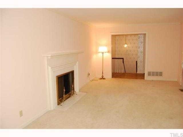 1428 10th Avenue Raleigh, NC 27607 - Photo 4 of 10 a view of a livingroom with a fireplace