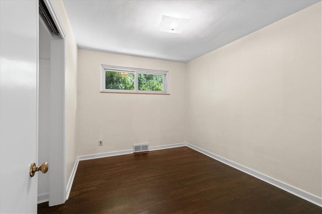 553 Fairoaks Street McKees Rocks, PA 15136 - Photo 14 of 22 an empty room with a wooden floor and a window