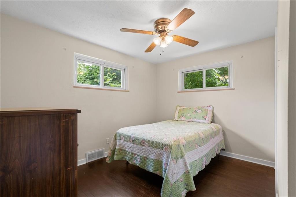 553 Fairoaks Street McKees Rocks, PA 15136 - Photo 8 of 22 a bedroom with a bed and a chandelier