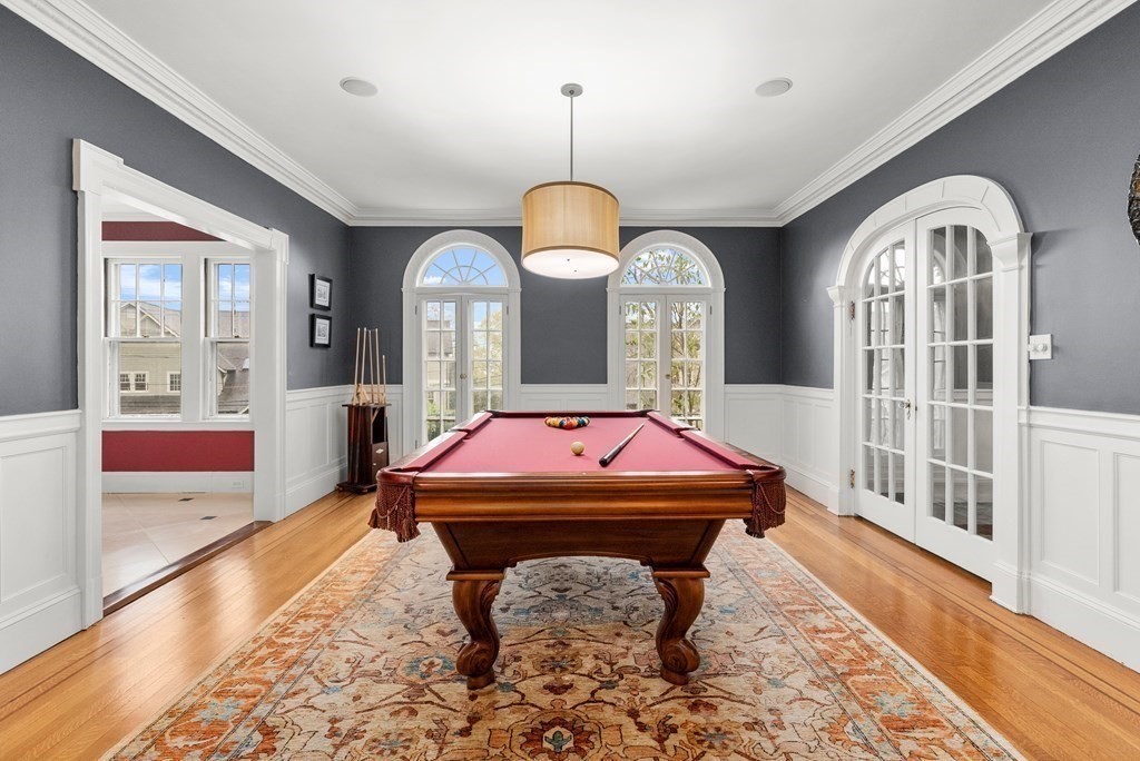 37 Colbourne Crescent Brookline, MA 02445 - Photo 5 of 29 a room with chandelier fan and wooden floor