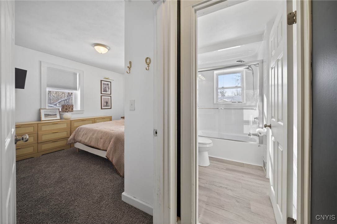 1315 Cold Springs Road Salina, NY 13090 - Photo 19 of 46 Off the dining room is the primary bedroom and ful