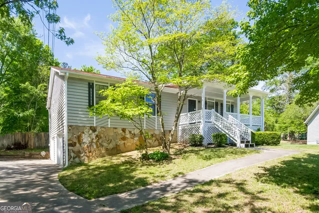 a front view of a house with garden