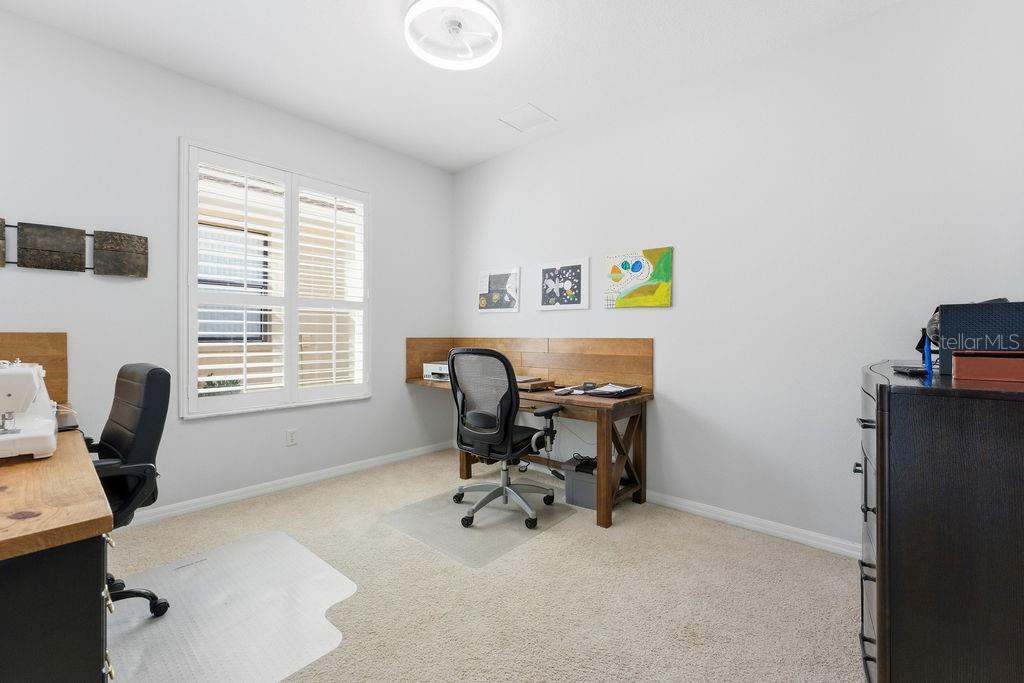 1338 Southwest 161st Place Ocala, FL 34473 - Photo 16 of 88 a view of a workspace with furniture and a window