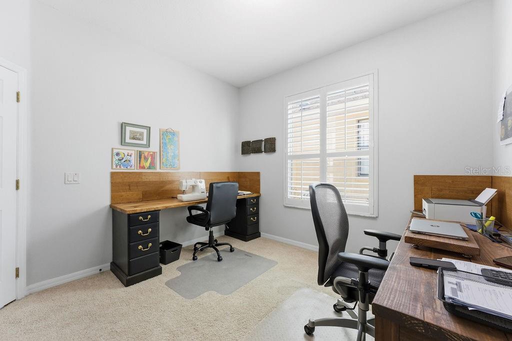 1338 Southwest 161st Place Ocala, FL 34473 - Photo 17 of 88 a view of a workspace with furniture and a window