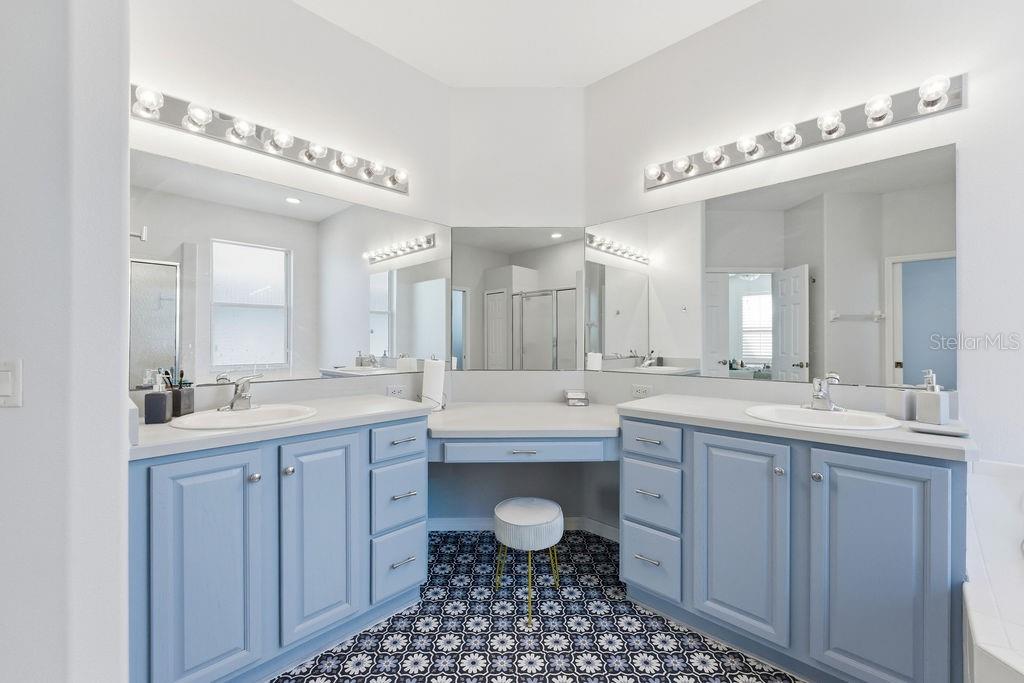 1338 Southwest 161st Place Ocala, FL 34473 - Photo 24 of 88 a spacious bathroom with a granite countertop sink a toilet a mirror and a bathtub