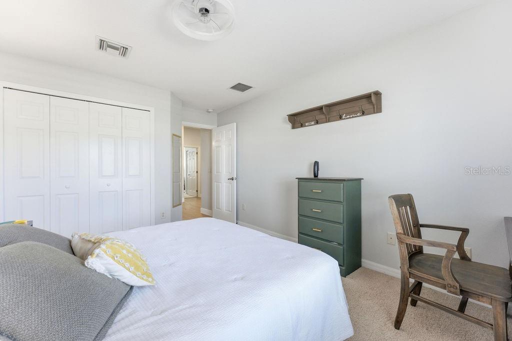 1338 Southwest 161st Place Ocala, FL 34473 - Photo 28 of 88 a bedroom with a bed and a chair in it