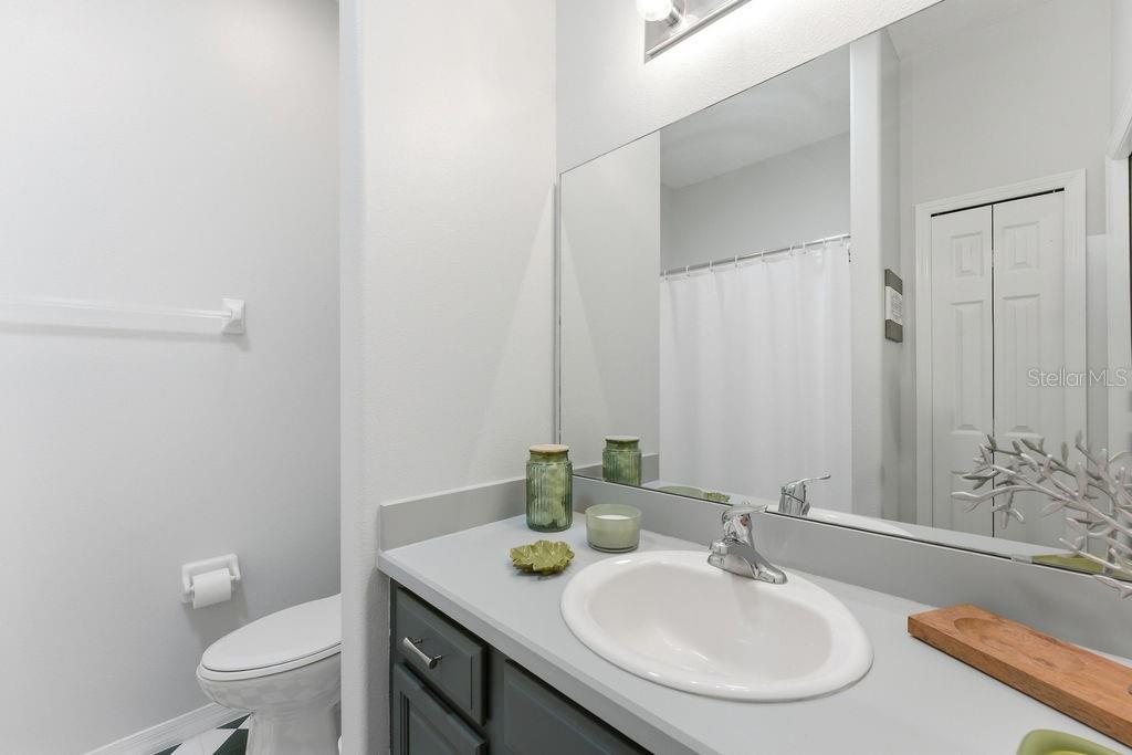 1338 Southwest 161st Place Ocala, FL 34473 - Photo 29 of 88 a bathroom with a sink and a mirror with toilet