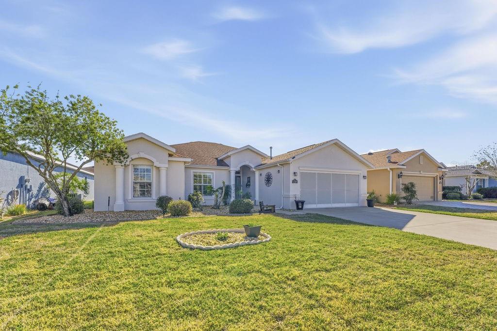 1338 Southwest 161st Place Ocala, FL 34473 - Photo 43 of 88 a front view of a house with a yard and large tree