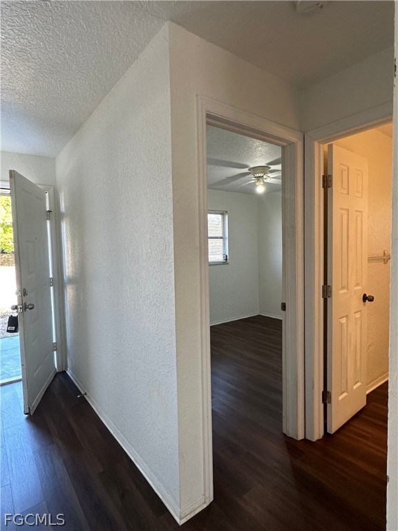 2429 George Avenue South, Unit 2431 Lehigh Acres, FL 33973 - Photo 12 of 16 wooden floor in an empty room