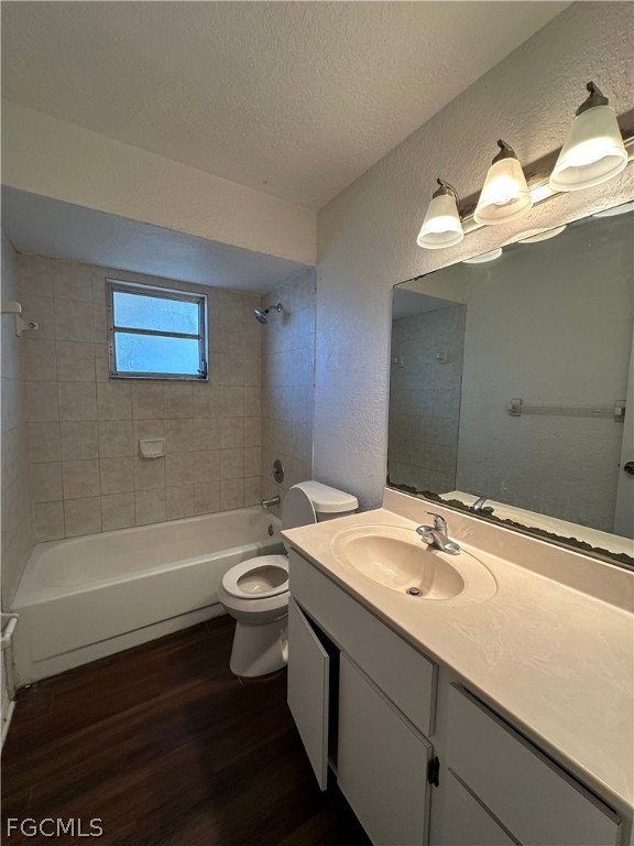 2429 George Avenue South, Unit 2431 Lehigh Acres, FL 33973 - Photo 13 of 16 a bathroom with a sink a toilet and a bathtub