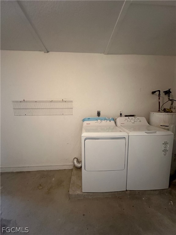 2429 George Avenue South, Unit 2431 Lehigh Acres, FL 33973 - Photo 15 of 16 a utility room with dryer and washer