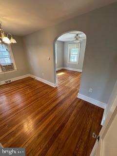 209 Ash Road Wallingford, PA 19086 - Photo 11 of 29 wooden floor in an empty room with a window