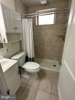 209 Ash Road Wallingford, PA 19086 - Photo 20 of 29 a bathroom with a toilet a sink and a shower
