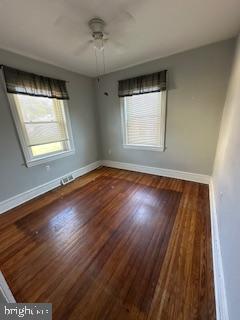 209 Ash Road Wallingford, PA 19086 - Photo 21 of 29 a view of an empty room with wooden floor and a window