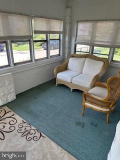 209 Ash Road Wallingford, PA 19086 - Photo 5 of 29 a living room with furniture and a floor to ceiling window