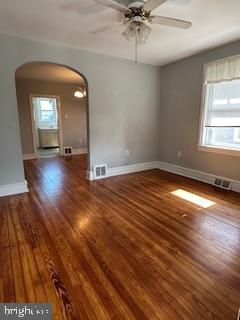 209 Ash Road Wallingford, PA 19086 - Photo 6 of 29 an empty room with wooden floor and windows
