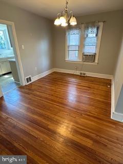 209 Ash Road Wallingford, PA 19086 - Photo 10 of 29 wooden floor in an empty room with a window