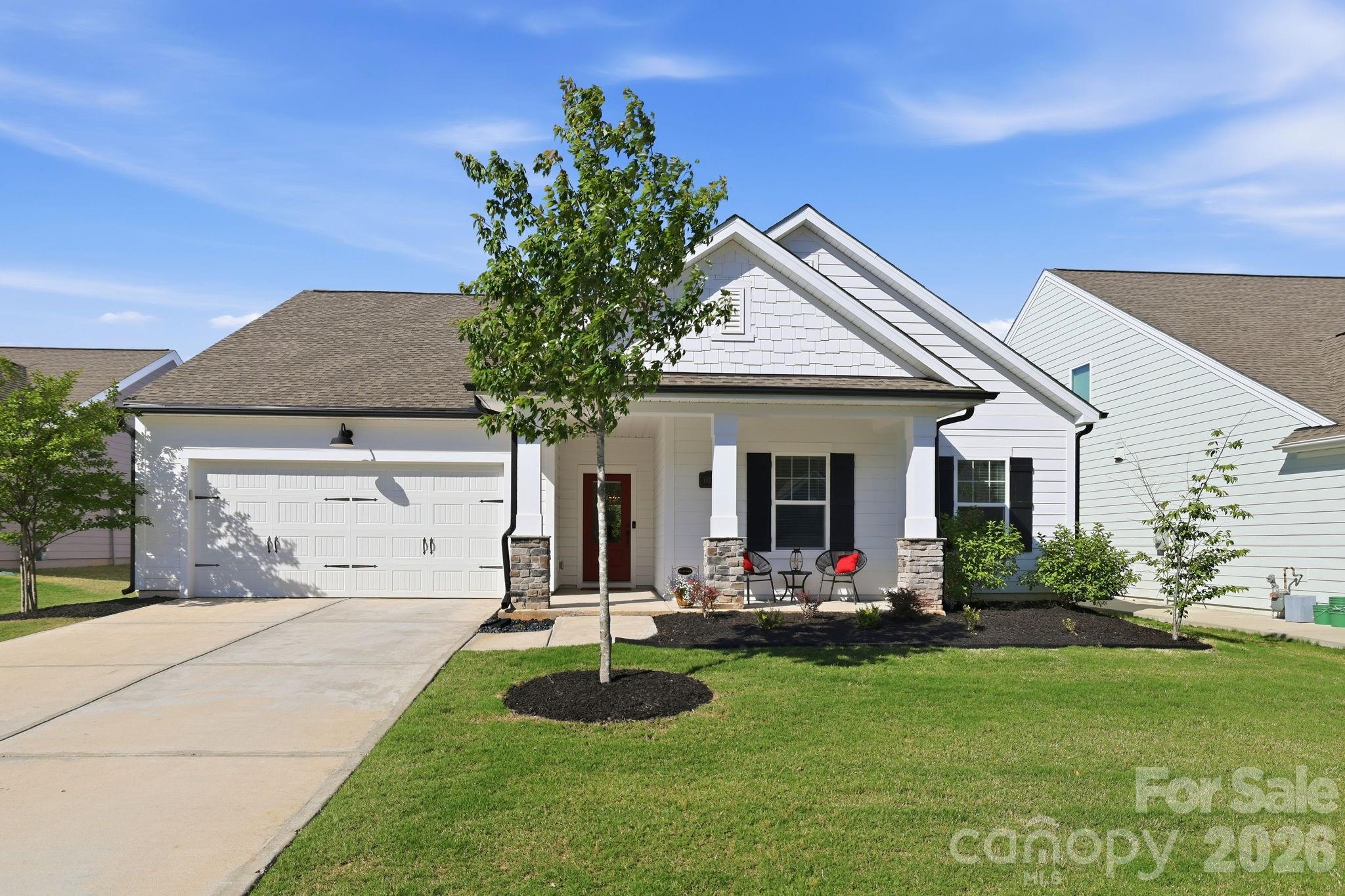 6038 Holland Street Fort Mill, SC 29707 - Photo 3 of 48 a front view of house with yard and green space