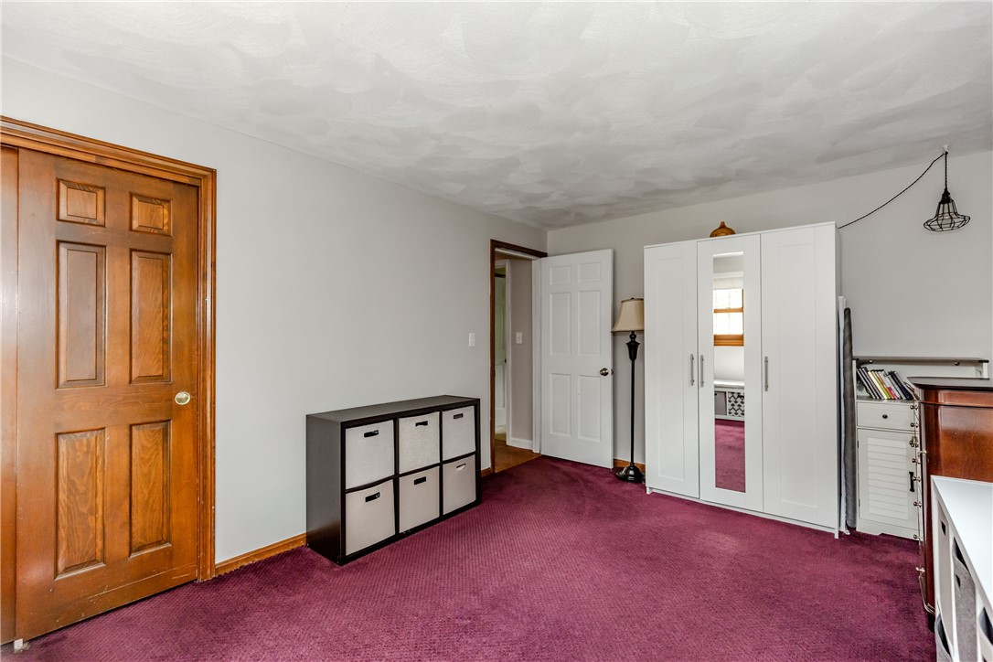 99 Tower Hill Road Cumberland, RI 02864 - Photo 21 of 43 Second bedroom conveniently located near the hallway, offering easy access to the rest of the home.