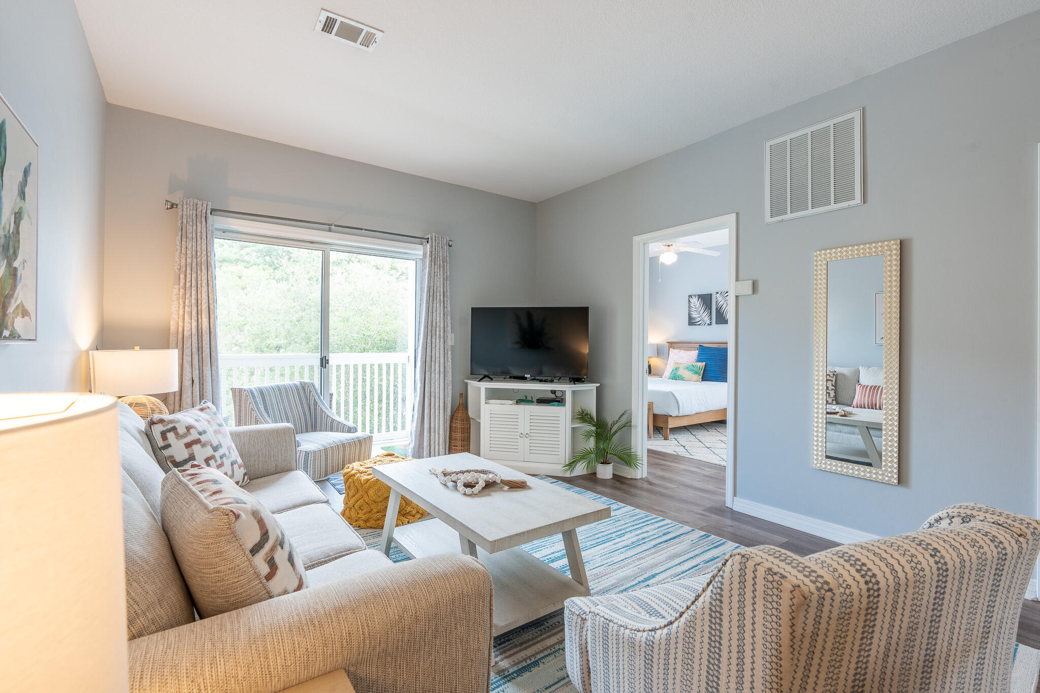 34 Heron's Watch Way, Unit 5205 Santa Rosa Beach, FL 32459 - Photo 15 of 50 a living room with furniture and a flat screen tv