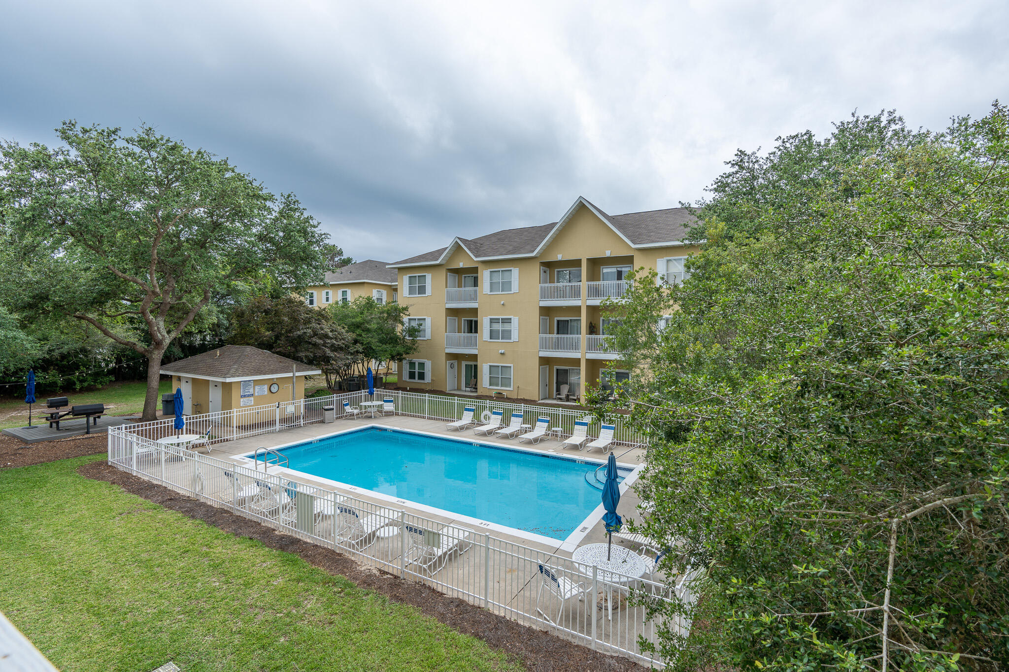 34 Heron's Watch Way, Unit 5205 Santa Rosa Beach, FL 32459 - Photo 29 of 50 a view of a house with pool and chairs
