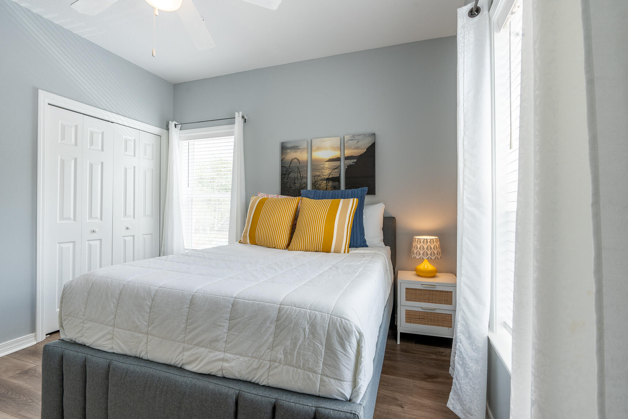 34 Heron's Watch Way, Unit 5205 Santa Rosa Beach, FL 32459 - Photo 30 of 50 a bedroom with a bed and wooden floor