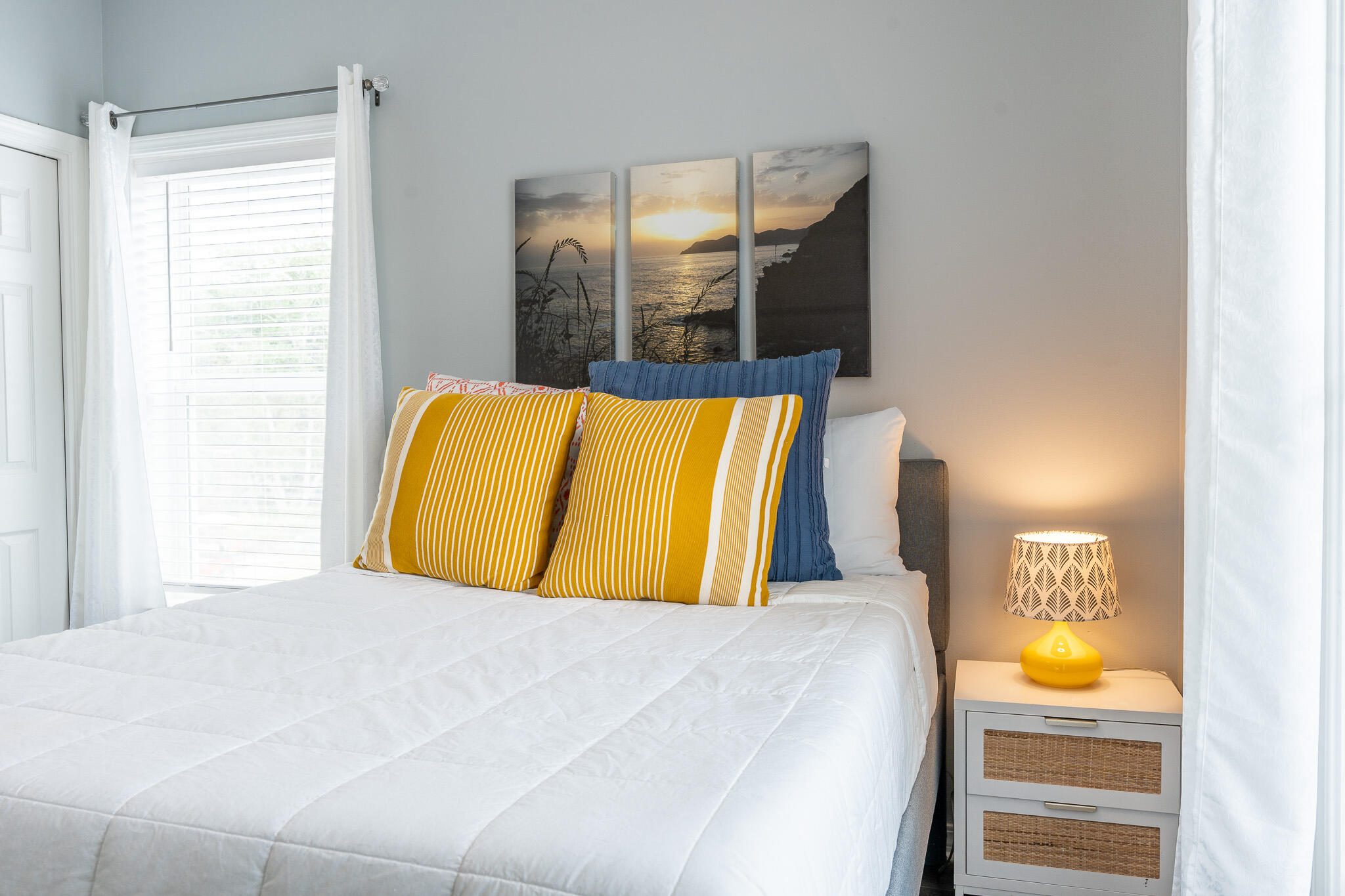 34 Heron's Watch Way, Unit 5205 Santa Rosa Beach, FL 32459 - Photo 32 of 50 a bedroom with a bed and painting on the wall