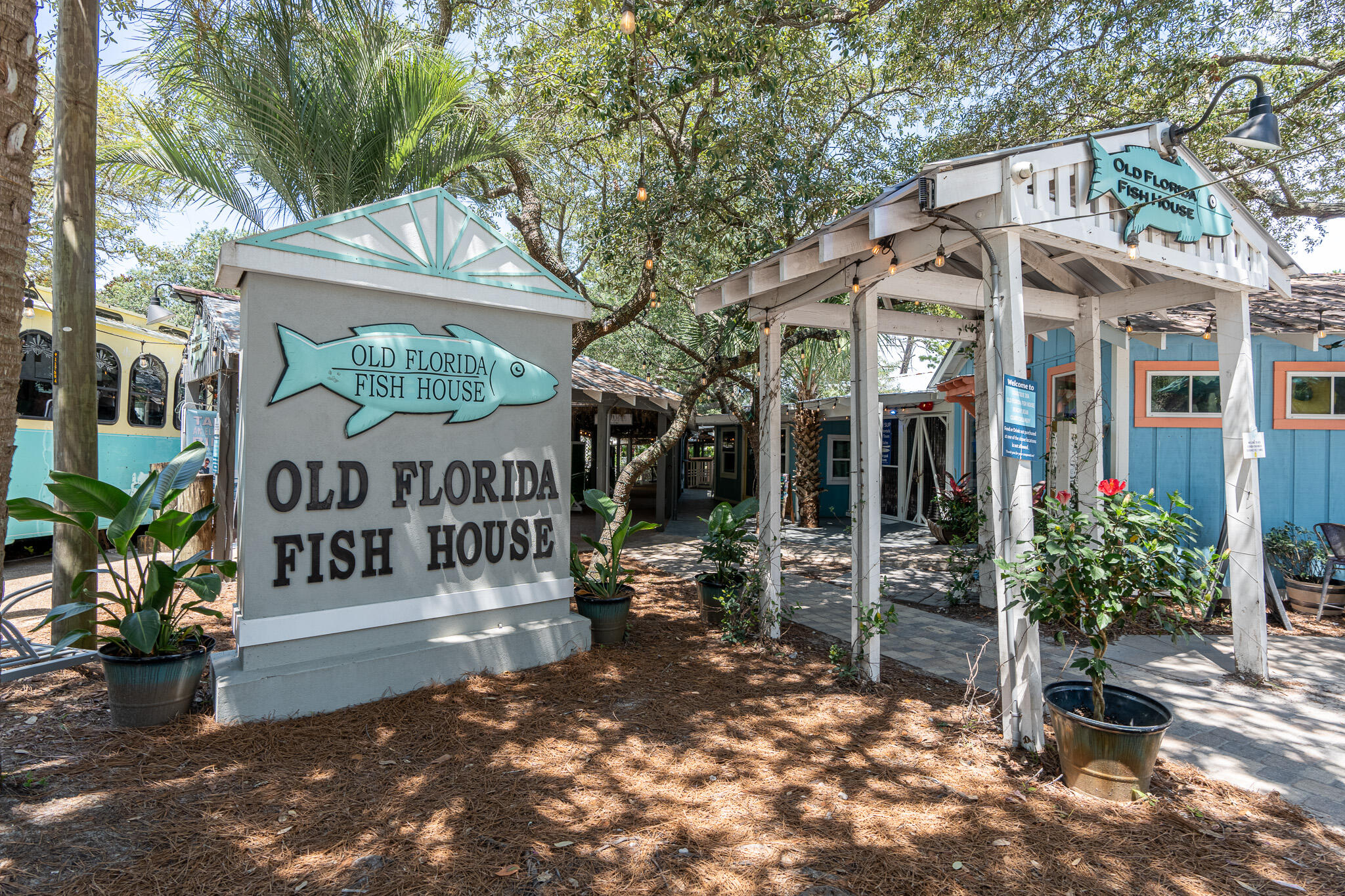 34 Heron's Watch Way, Unit 5205 Santa Rosa Beach, FL 32459 - Photo 47 of 50 a view of a sign board with large trees