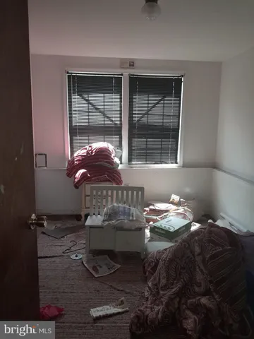 a room with a table and a fireplace