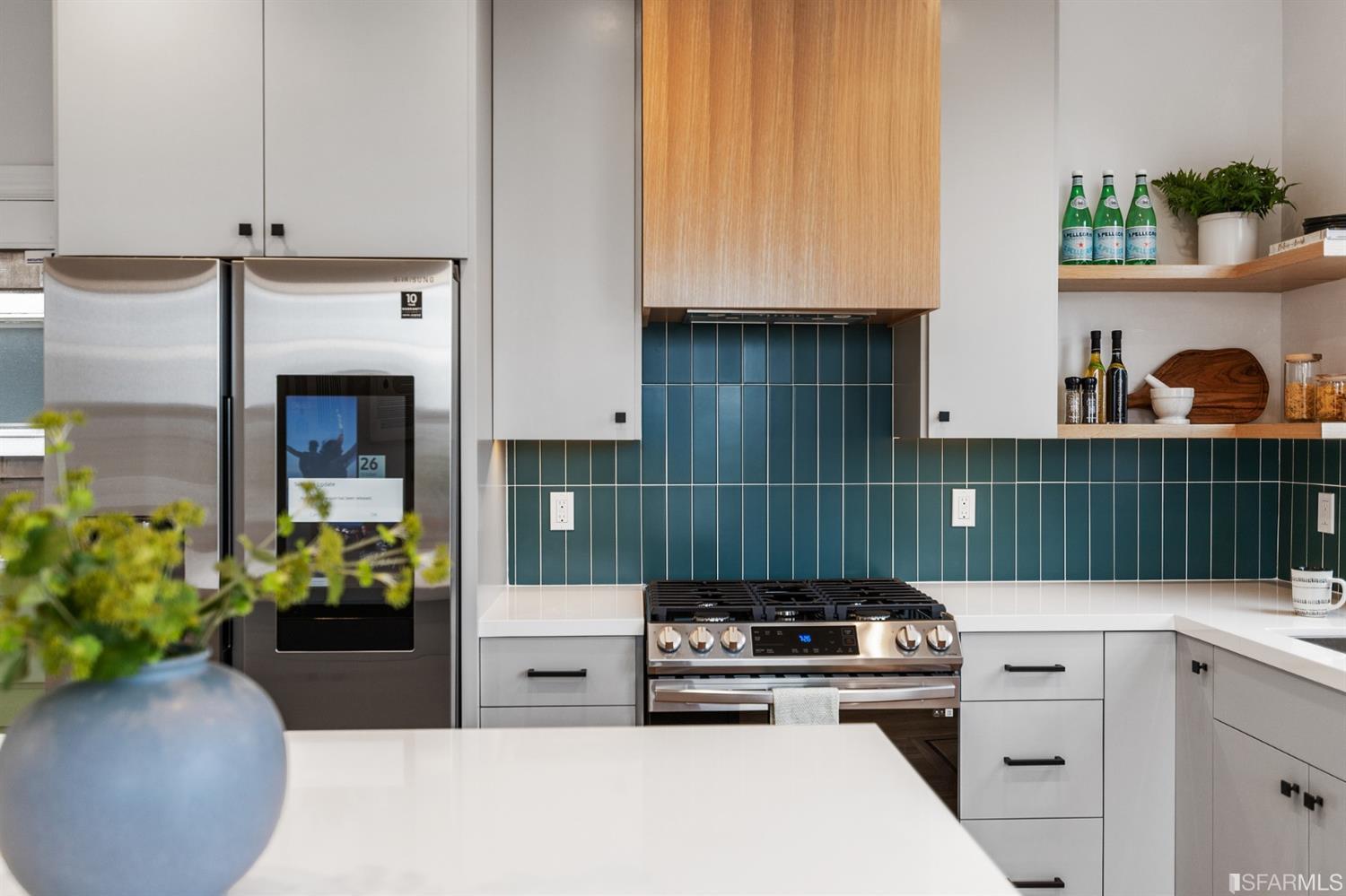 8 Joy Street San Francisco, CA 94110 - Photo 14 of 42 a kitchen with a stove and a white wooden cabinets