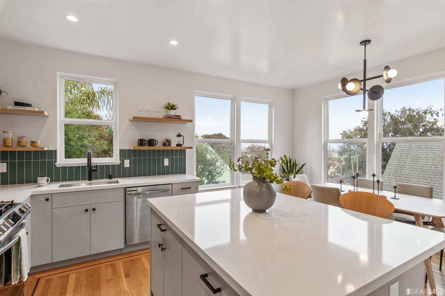 8 Joy Street San Francisco, CA 94110 - Photo 16 of 42 a view of a kitchen area with furniture and large windows