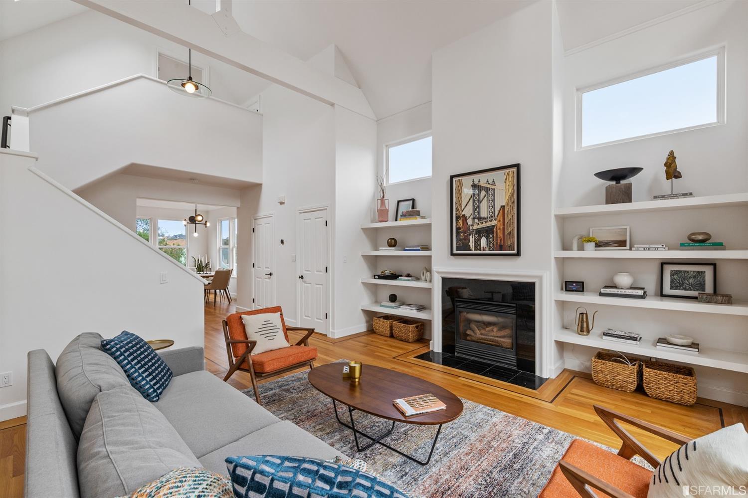 8 Joy Street San Francisco, CA 94110 - Photo 3 of 42 a living room with furniture flat screen tv and a fireplace