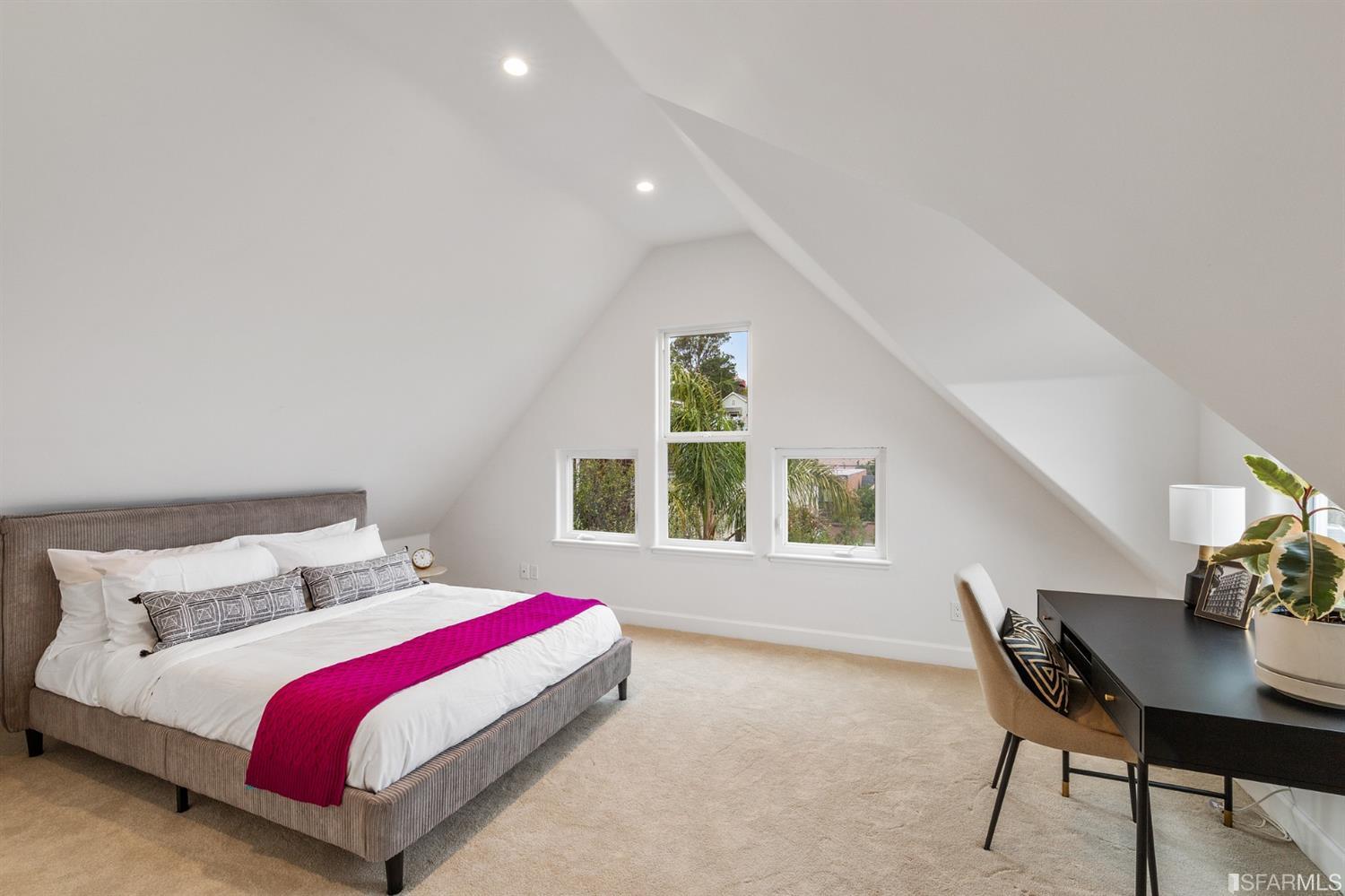 8 Joy Street San Francisco, CA 94110 - Photo 21 of 42 a bedroom with a bed and a table in it