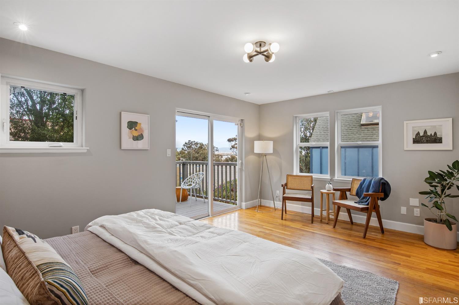 8 Joy Street San Francisco, CA 94110 - Photo 27 of 42 a bedroom with a bed and wooden floor
