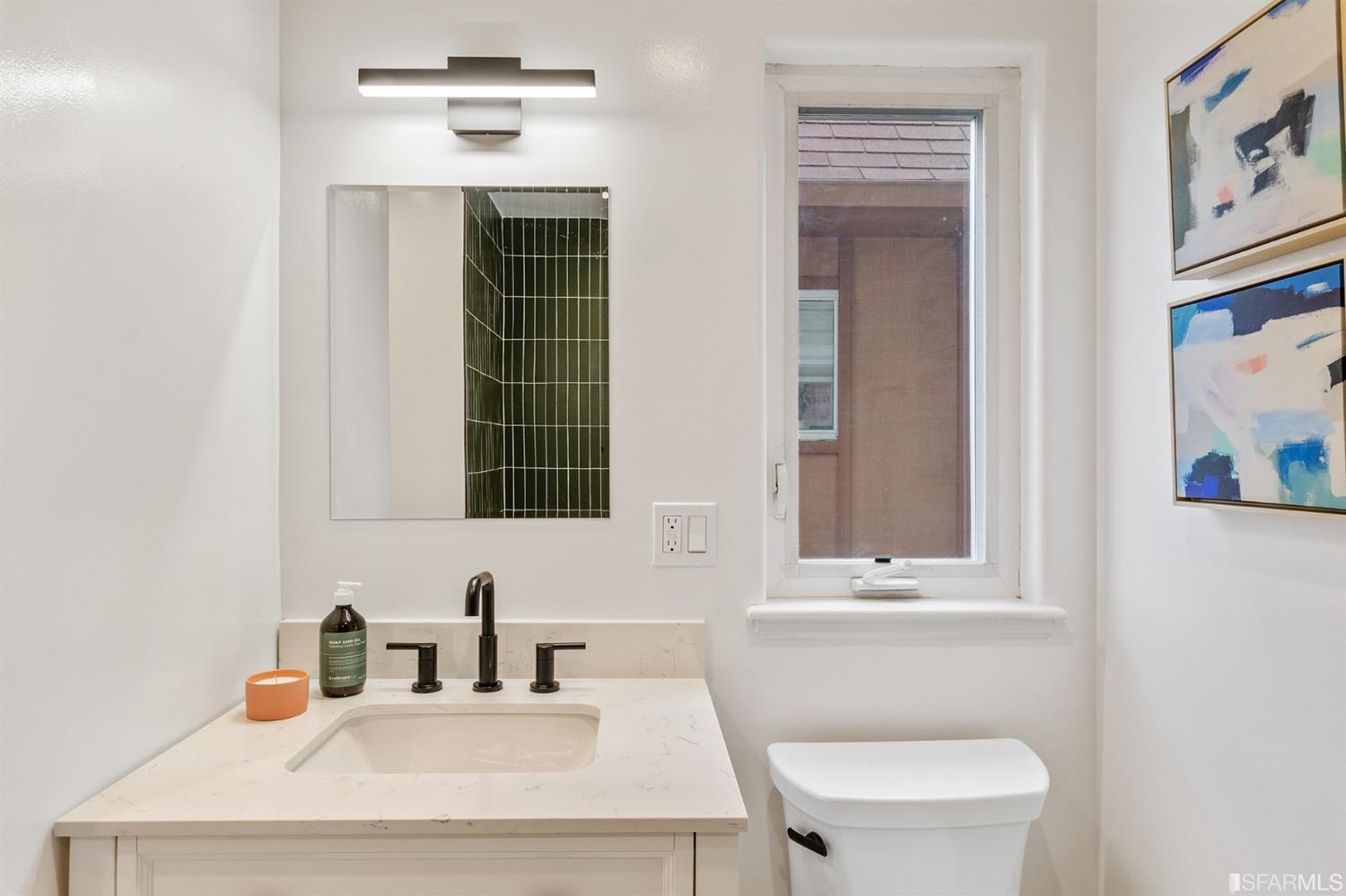 8 Joy Street San Francisco, CA 94110 - Photo 34 of 42 a bathroom with a toilet a sink a vanity and mirror