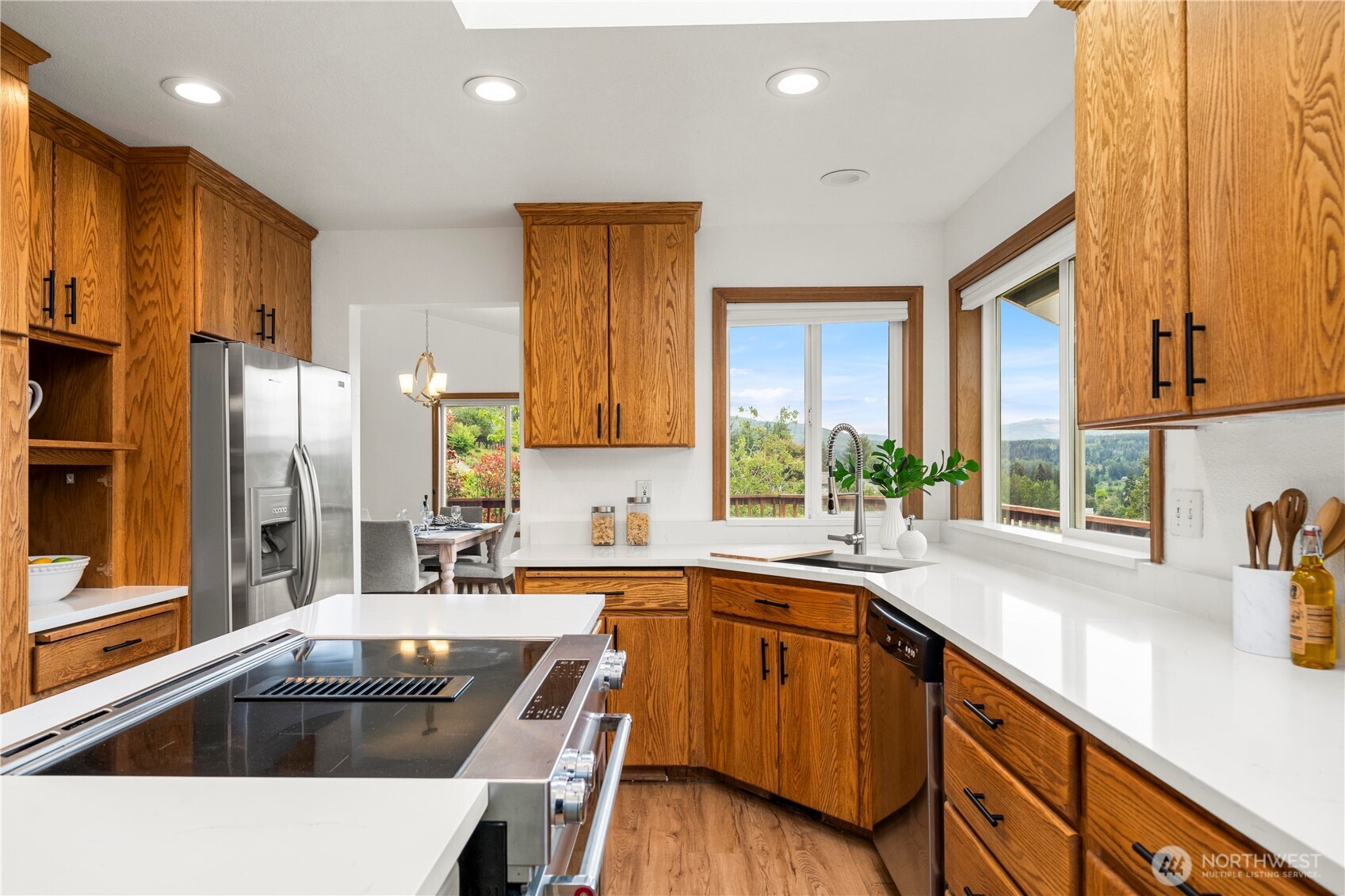 183 Dow Ridge Drive North Eatonville, WA 98328 - Photo 13 of 40 a kitchen filled a sink a counter top space and stainless steel appliances