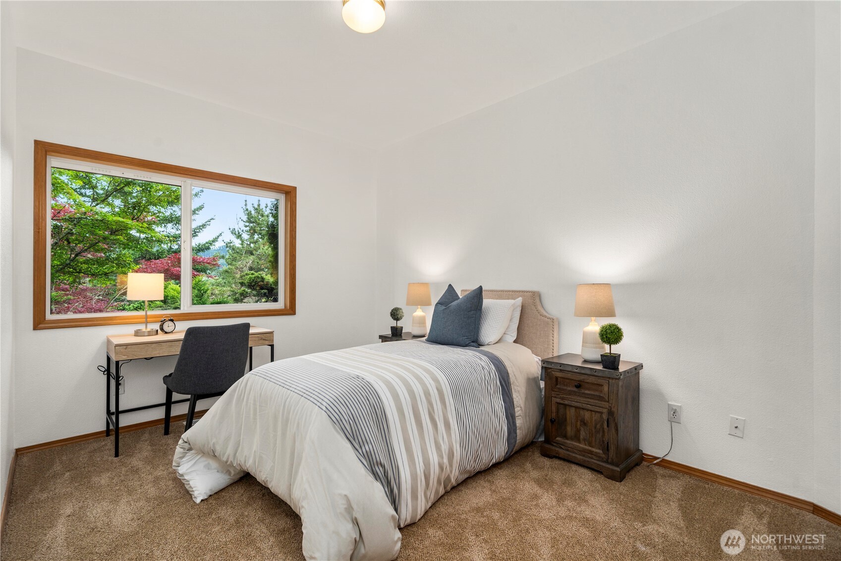 183 Dow Ridge Drive North Eatonville, WA 98328 - Photo 27 of 40 a bedroom with a bed and a large window