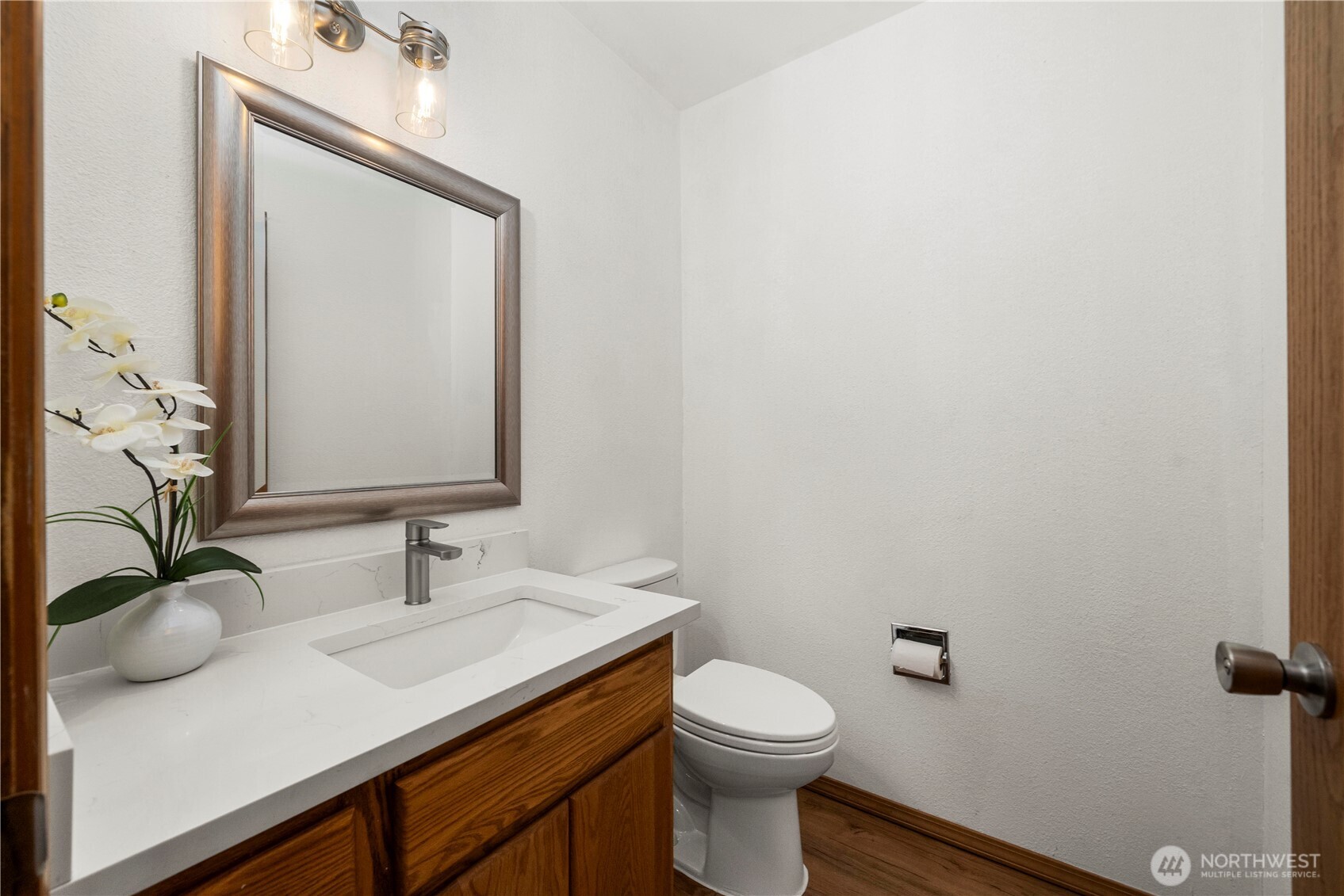 183 Dow Ridge Drive North Eatonville, WA 98328 - Photo 29 of 40 a bathroom with a sink a toilet and mirror