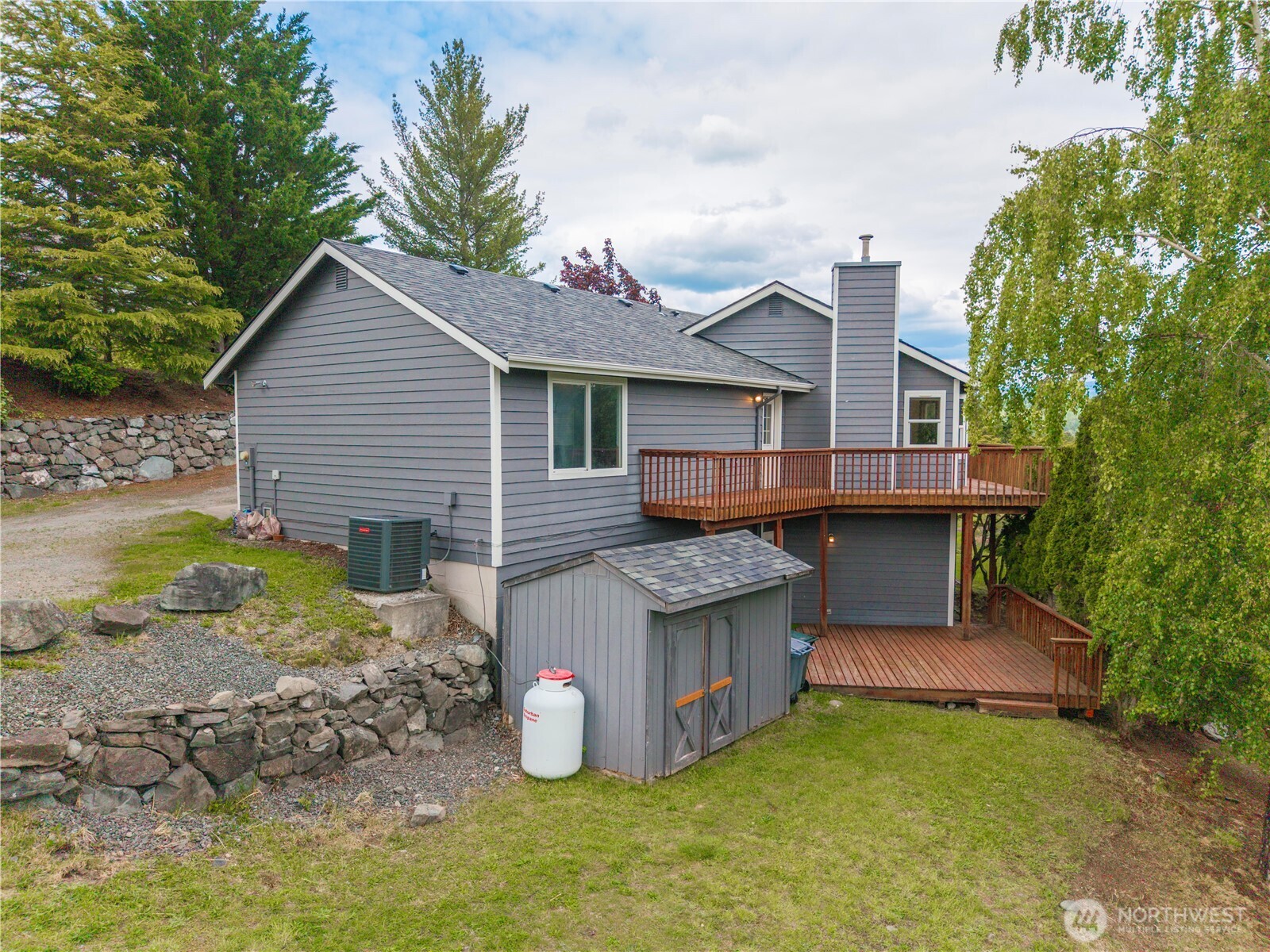 183 Dow Ridge Drive North Eatonville, WA 98328 - Photo 33 of 40 a view of a house with a yard and sitting area